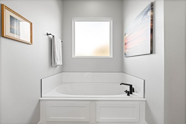 bathroom featuring a bath
