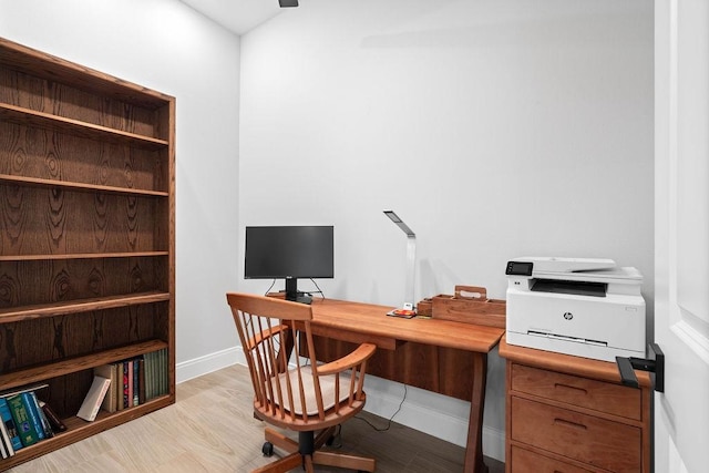 office area featuring baseboards and wood finished floors