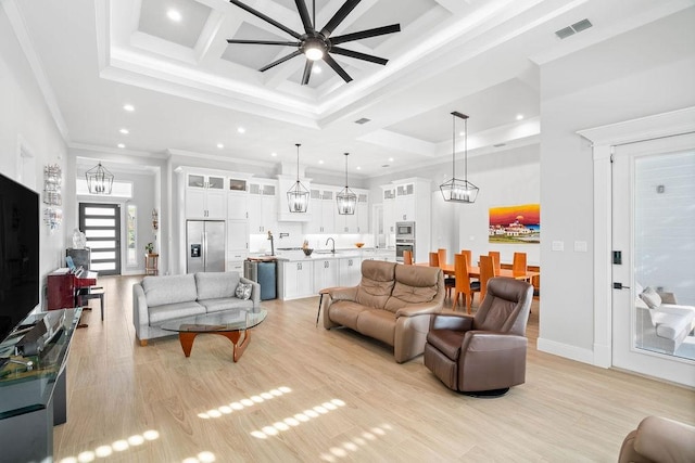 living room featuring visible vents, recessed lighting, coffered ceiling, and ceiling fan with notable chandelier