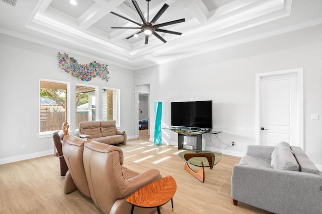 living area with a ceiling fan, baseboards, light wood finished floors, ornamental molding, and coffered ceiling
