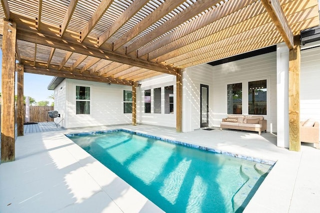 view of swimming pool featuring a patio, a fenced in pool, fence, and a pergola