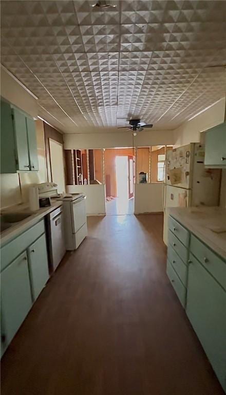 1246 Kenney Ln, Ingleside, TX 78362 - kitchen with green cabinetry, white electric range oven, stainless steel dishwasher, a ceiling fan, and light countertops