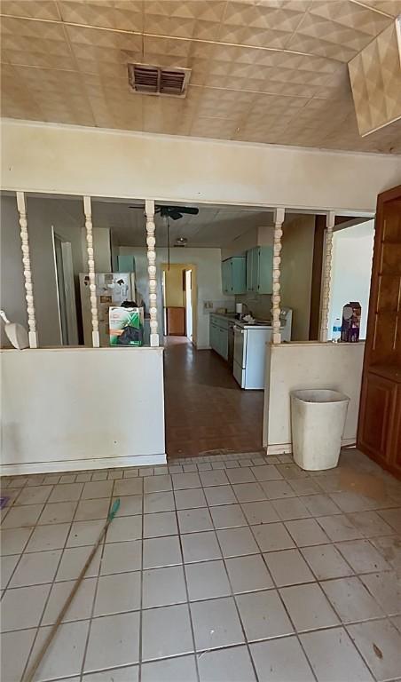 1246 Kenney Ln, Ingleside, TX 78362 - kitchen with freestanding refrigerator and white stove