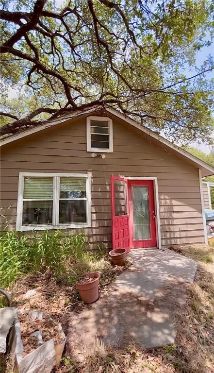1246 Kenney Ln, Ingleside, TX 78362 - view of front facade featuring a patio