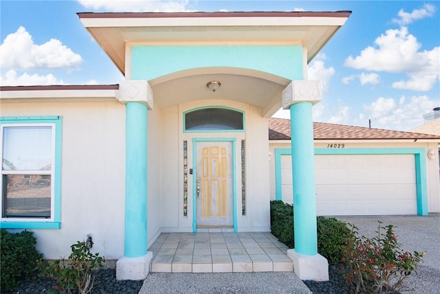 entrance to property featuring a garage