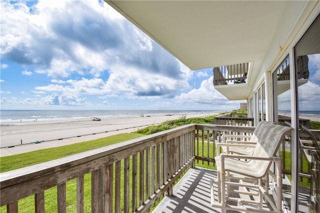 balcony with a view of the beach and a water view