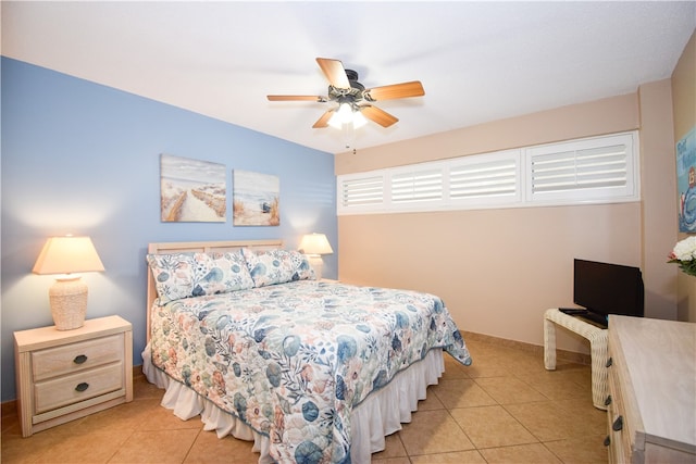 tiled bedroom with ceiling fan