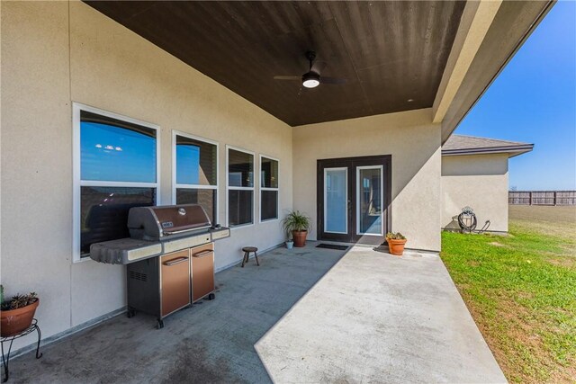 view of patio with grilling area and ceiling fan