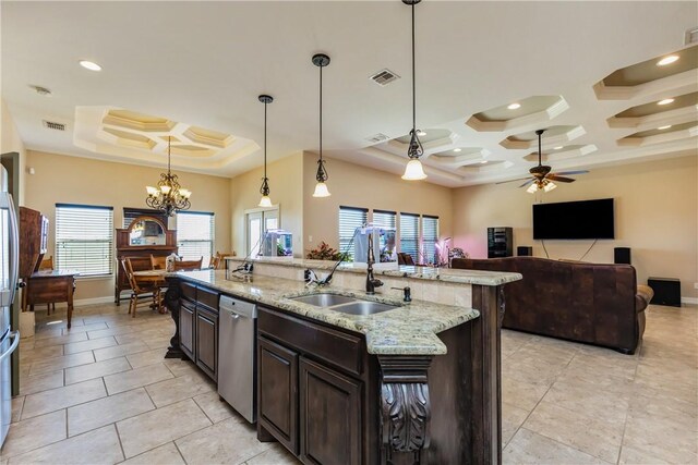 kitchen featuring visible vents, coffered ceiling, an island with sink, a sink, and stainless steel dishwasher