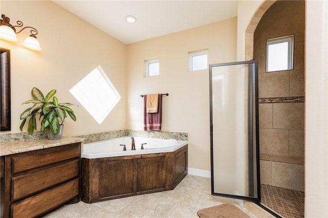 full bathroom with a wealth of natural light, a bath, a shower stall, and tile patterned flooring