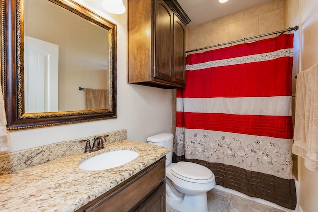 bathroom featuring a shower with shower curtain, toilet, vanity, and tile patterned flooring