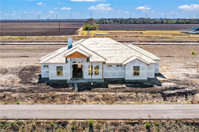 property in mid-construction featuring a rural view