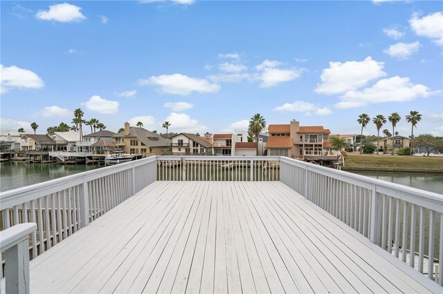 deck featuring a water view and a residential view