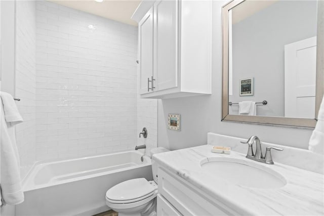 bathroom with toilet, shower / bathtub combination, and vanity