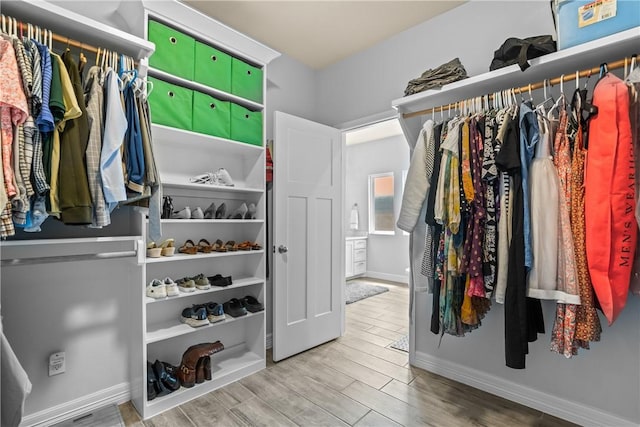 spacious closet with wood finished floors