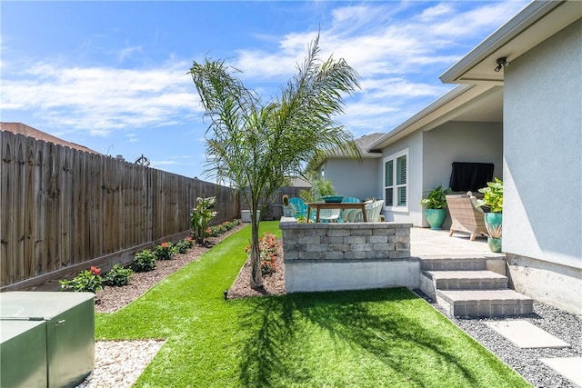 view of yard with a fenced backyard and a patio area