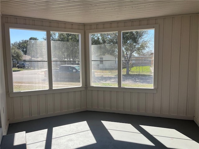 unfurnished sunroom featuring plenty of natural light