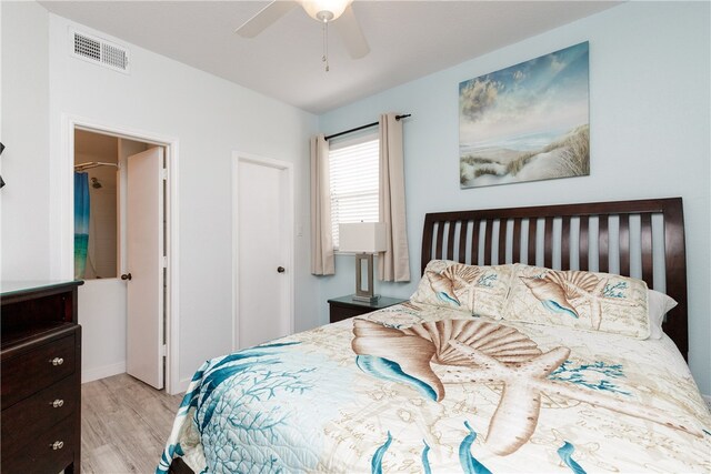 bedroom with ceiling fan and light hardwood / wood-style flooring