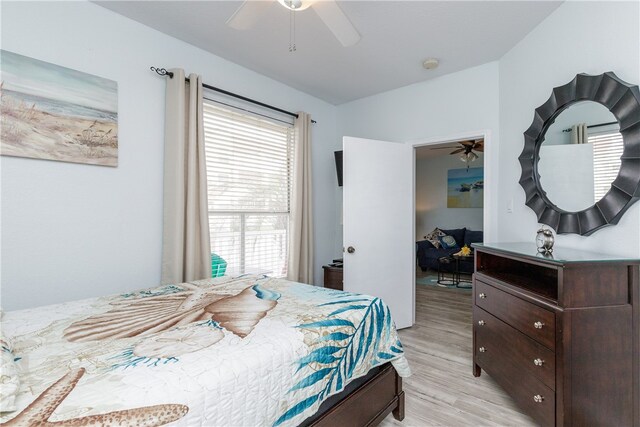 bedroom featuring light hardwood / wood-style floors and ceiling fan