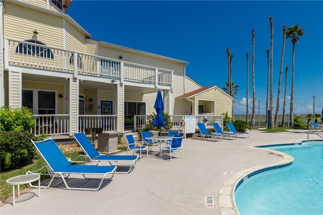 view of swimming pool featuring a patio area