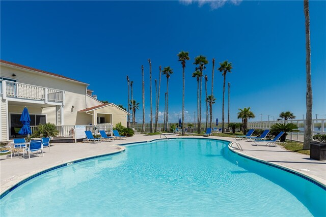 view of pool featuring a patio