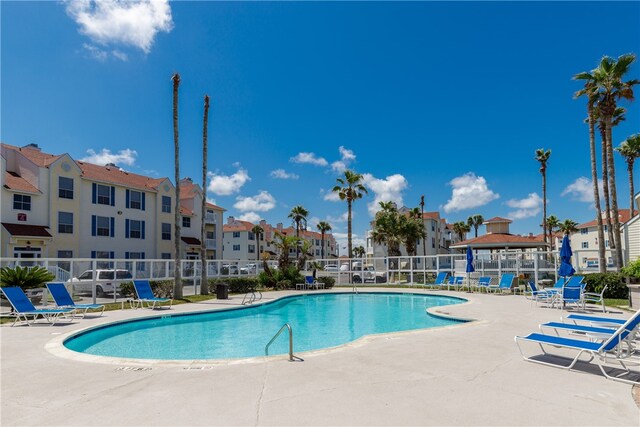 view of swimming pool with a patio