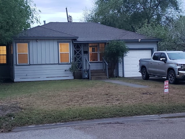 ranch-style house with an attached garage and a shingled roof