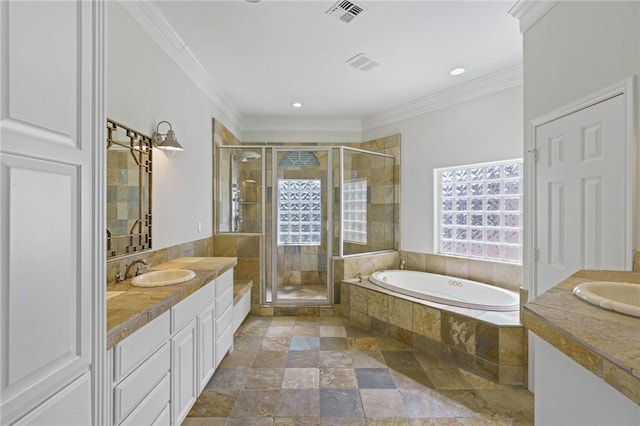 10 Kingfisher Ln, Rockport, TX 78382 - bathroom with vanity, stone tile flooring, a bath, a shower stall, and recessed lighting