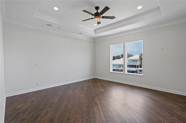 10 Kingfisher Ln, Rockport, TX 78382 - spare room with a tray ceiling, dark wood finished floors, ornamental molding, ceiling fan, and recessed lighting