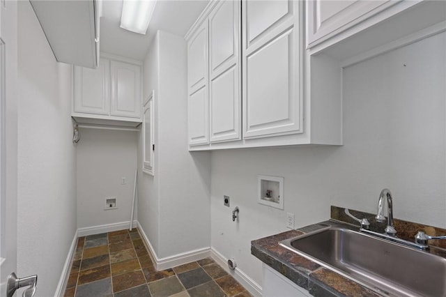 10 Kingfisher Ln, Rockport, TX 78382 - washroom featuring cabinet space, electric dryer hookup, washer hookup, and dark stone finish flooring