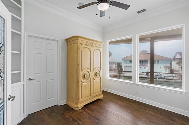 10 Kingfisher Ln, Rockport, TX 78382 - bedroom featuring ornamental molding, dark wood-type flooring, and a ceiling fan