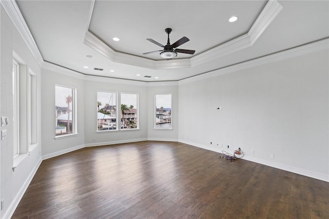 10 Kingfisher Ln, Rockport, TX 78382 - unfurnished room featuring crown molding, a raised ceiling, a ceiling fan, dark wood-style floors, and recessed lighting