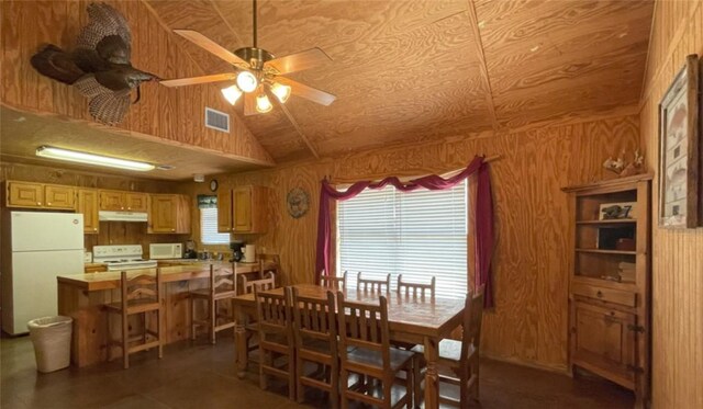 197 N Tomahawk Way, Concan, TX 78838 - dining area featuring wood walls, ceiling fan, and lofted ceiling