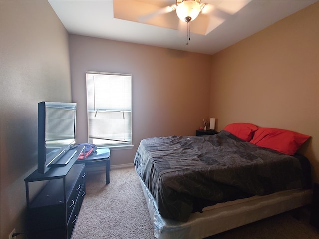 bedroom with light carpet and ceiling fan