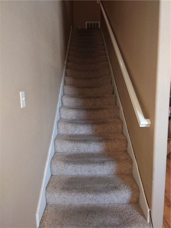 stairway with carpet flooring