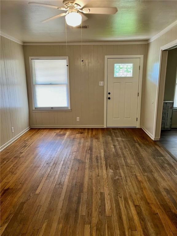 4225 Lowman St, Corpus Christi, TX 78411 - entryway featuring ceiling fan, dark wood-style flooring, ornamental molding, and baseboards