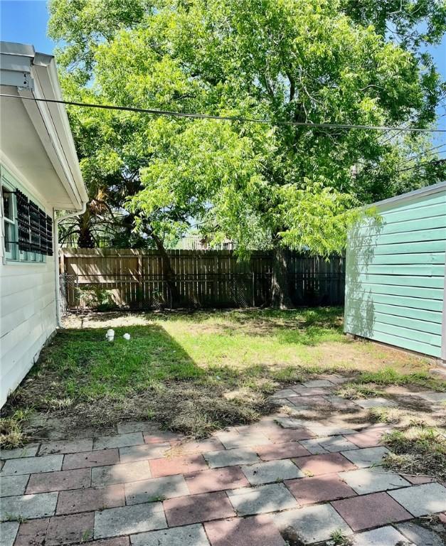 4225 Lowman St, Corpus Christi, TX 78411 - fenced backyard featuring a patio area