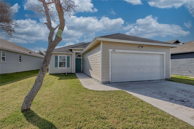 ranch-style house featuring a garage and a front lawn