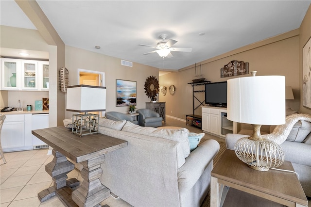 living room with ceiling fan and light tile patterned floors