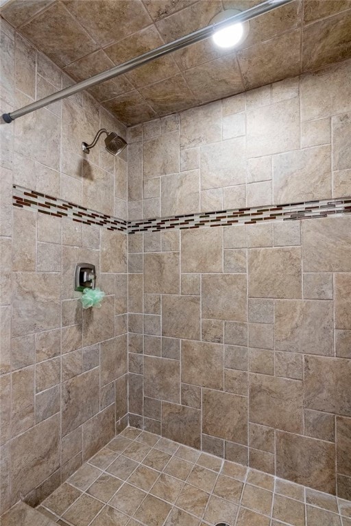 bathroom with a tile shower