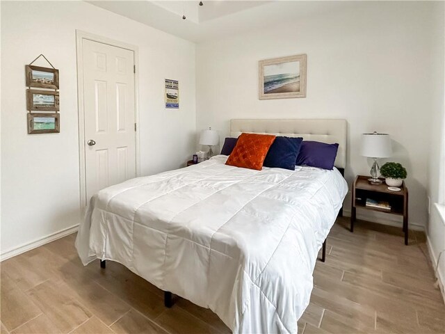 2418 Mystic Star Dr, Corpus Christi, TX 78414 - bedroom featuring wood finished floors and baseboards