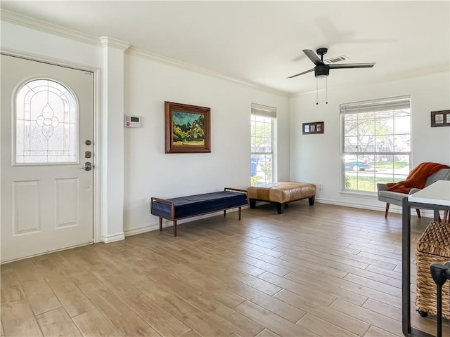 2418 Mystic Star Dr, Corpus Christi, TX 78414 - foyer with light wood finished floors, ornamental molding, ceiling fan, and baseboards