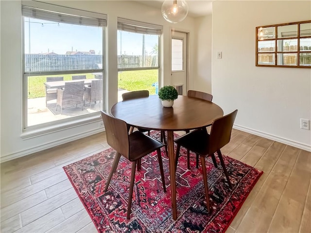 2418 Mystic Star Dr, Corpus Christi, TX 78414 - dining room with wood finished floors, plenty of natural light, and baseboards