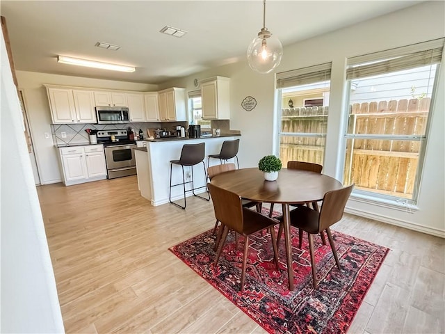 2418 Mystic Star Dr, Corpus Christi, TX 78414 - dining space featuring light wood finished floors