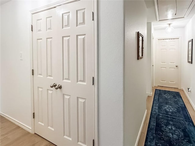 2418 Mystic Star Dr, Corpus Christi, TX 78414 - corridor featuring light wood-type flooring, attic access, and baseboards