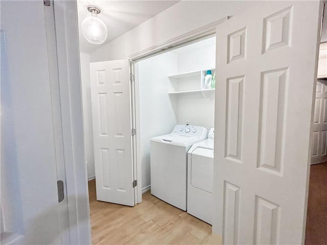 2418 Mystic Star Dr, Corpus Christi, TX 78414 - clothes washing area featuring separate washer and dryer and light wood-style flooring