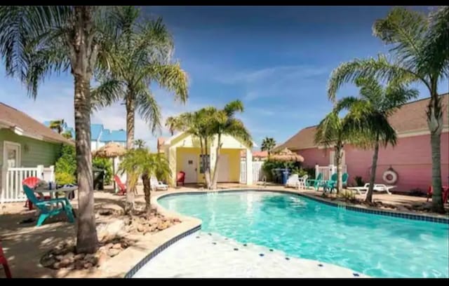 view of swimming pool featuring a patio area