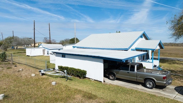 view of side of property with a lawn