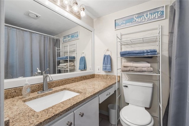 full bath with vanity and toilet