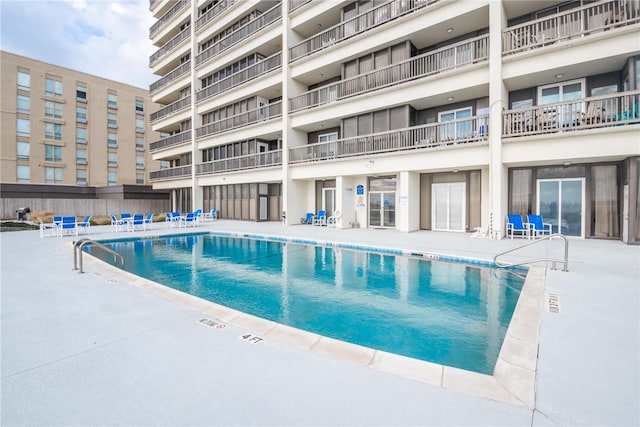 view of swimming pool featuring a patio area